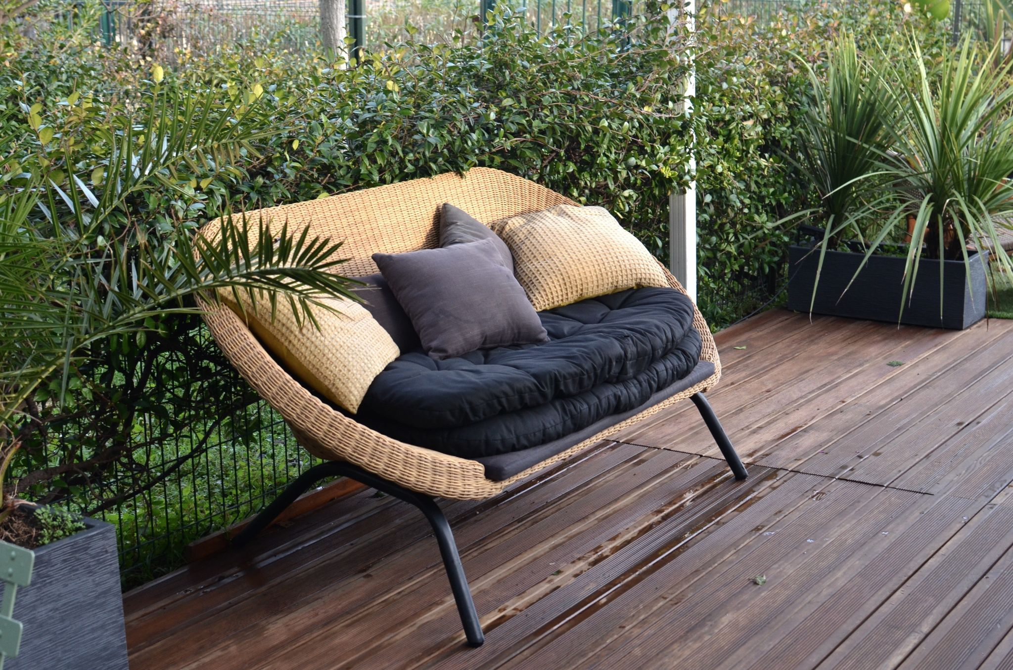 Rattan sofa with cushions