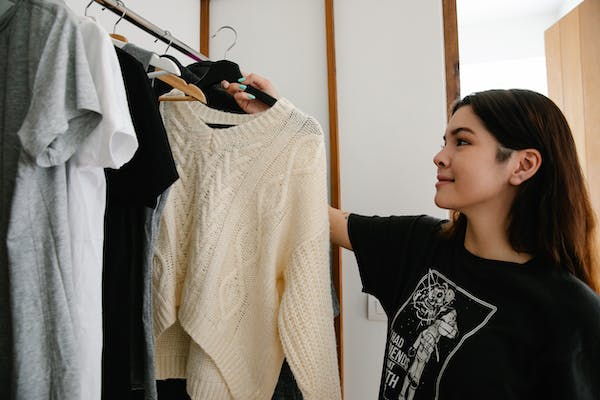 a woman picking out clothes